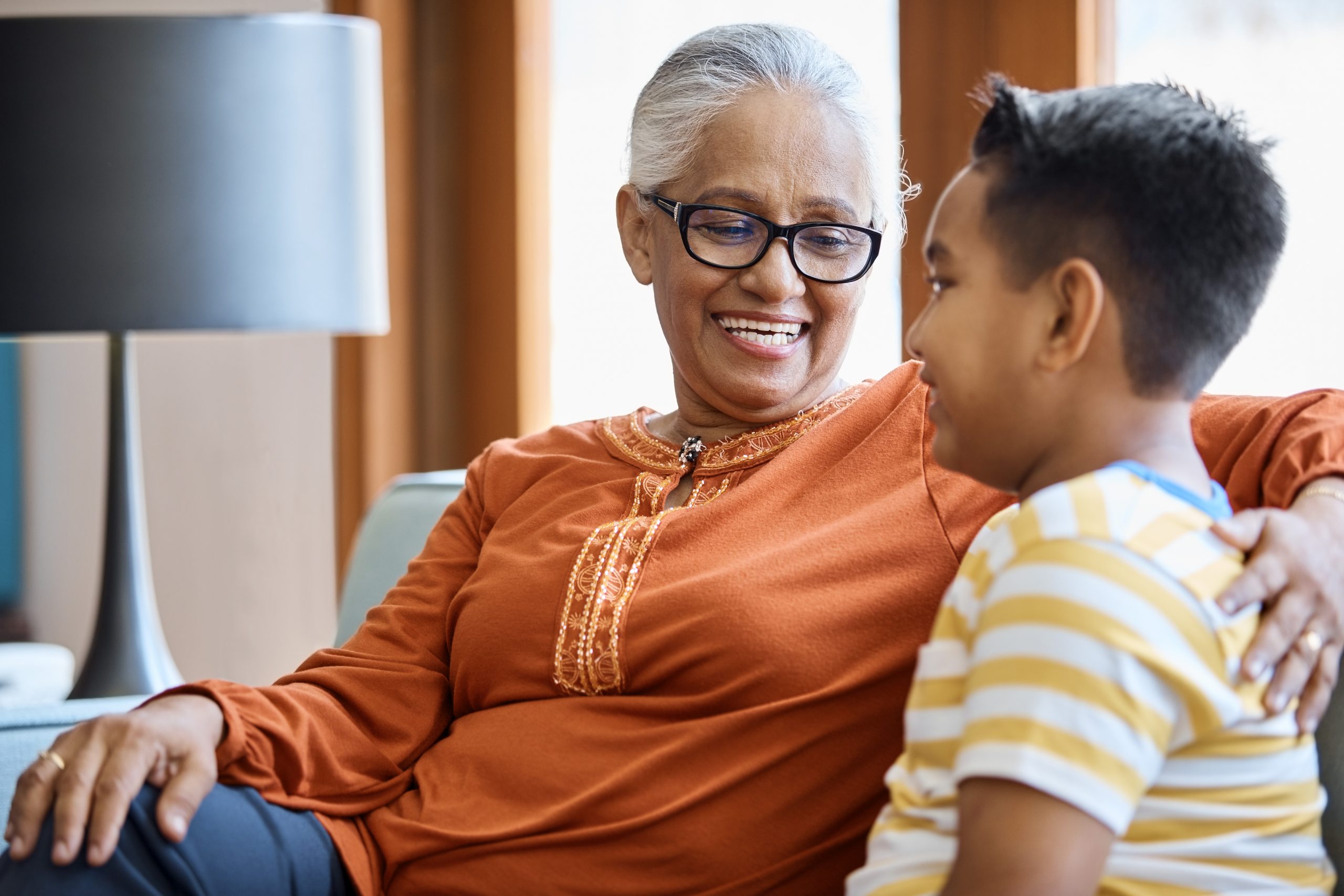 Smiling senior woman looking at grandson